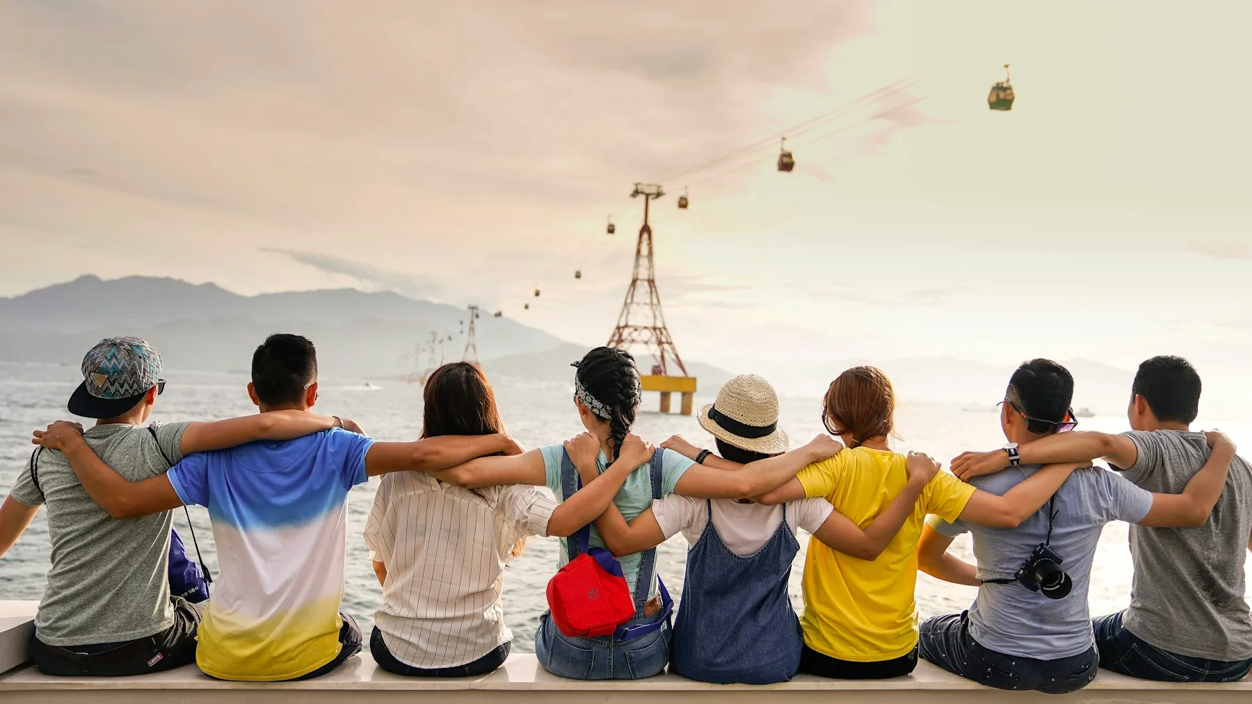 A group of friends enjoying a seaside view together